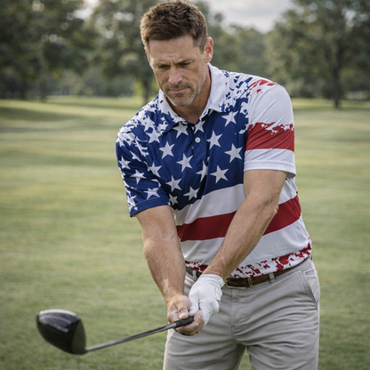 Man in a golf course wearing a patriotic shirt, holding a golf club.